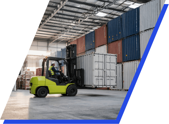 Warehouse team consolidating cargo into a shipping container