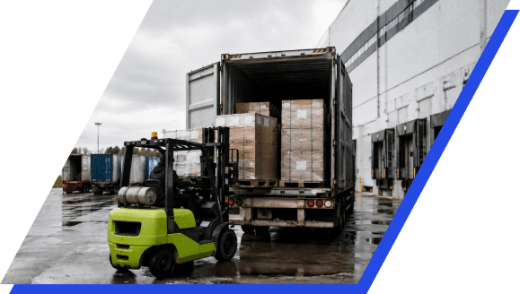 Forklift loading a shared shipping container